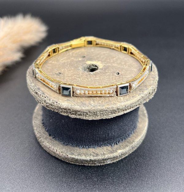 Edwardian Antique Sapphire and Seed Pearl Link Bracelet, long rectangular links with delicate row of natural seed pearls interspersed with square-cut sapphires in platinum and 18ct yellow gold.. Circa 1910