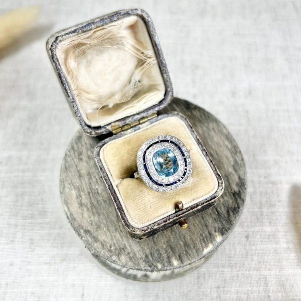 Edwardian Antique Cushion Cut Aquamarine Sapphire and Old Cut Diamond Double Halo Cluster Target Ring in platinum Circa 1910