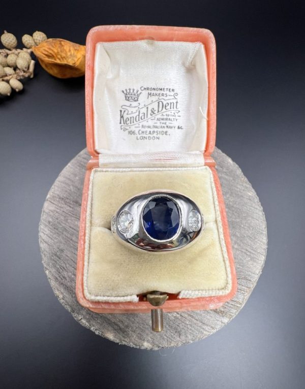 Art Deco French Sapphire and Diamond Five Stone Bombe Ring, oval blue sapphire sits proud flanked by two diamonds running down each shoulder in 18ct white gold. Circa 1920s