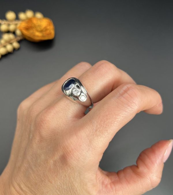 Art Deco French Sapphire and Diamond Five Stone Bombe Ring, oval blue sapphire sits proud flanked by two diamonds running down each shoulder in 18ct white gold. Circa 1920s