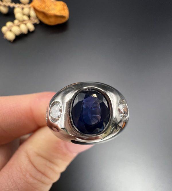 Art Deco French Sapphire and Diamond Five Stone Bombe Ring, oval blue sapphire sits proud flanked by two diamonds running down each shoulder in 18ct white gold. Circa 1920s
