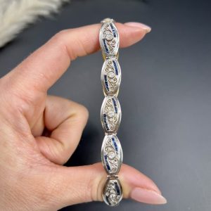 Edwardian Antique Old Cut Diamond and Sapphire Oval Fancy Link Bracelet, Each link set with old cut diamonds accented with calibre sapphire edges in platinum to 18ct yellow gold