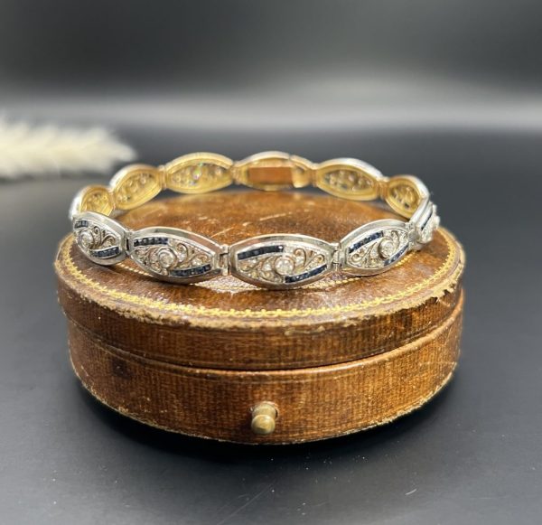 Edwardian Antique Old Cut Diamond and Sapphire Oval Fancy Link Bracelet, Each link set with old cut diamonds accented with calibre sapphire edges in platinum to 18ct yellow gold