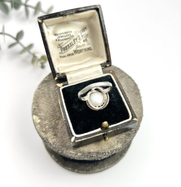 Edwardian Antique Pearl Emerald Diamond Snake Ring in Platinum, diamond-set snake coiled around pearl with emerald eyes in platinum, Circa 1910