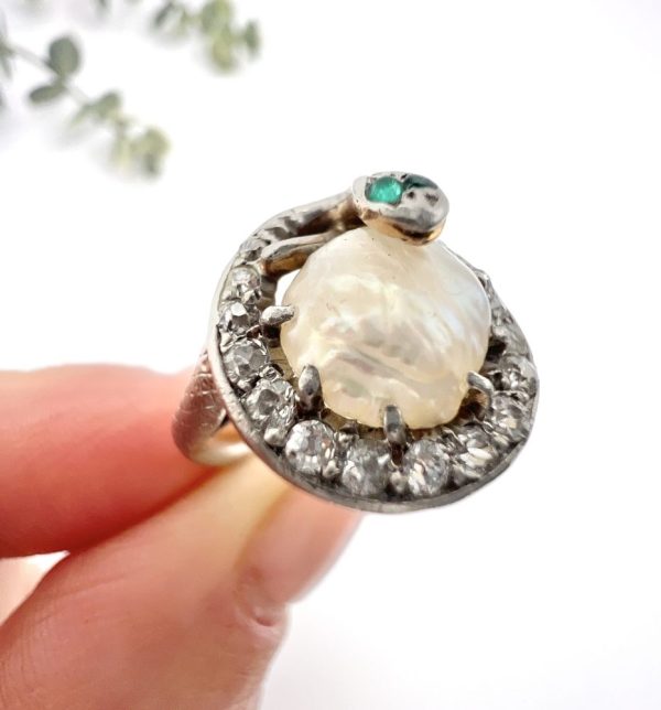 Edwardian Antique Pearl Emerald Diamond Snake Ring in Platinum, diamond-set snake coiled around pearl with emerald eyes in platinum, Circa 1910