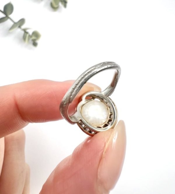 Edwardian Antique Pearl Emerald Diamond Snake Ring in Platinum, diamond-set snake coiled around pearl with emerald eyes in platinum, Circa 1910