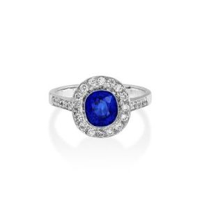 cushion cut sapphire and diamond cluster ring set in 18ct white gold
