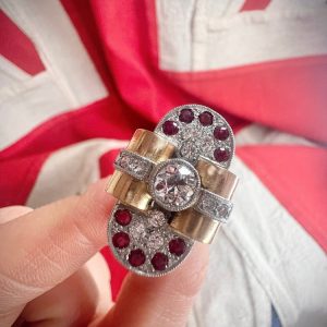 Art Deco French Diamond and Ruby Bow Cluster Statement Cocktail Ring in 18ct yellow gold. Circa 1920s