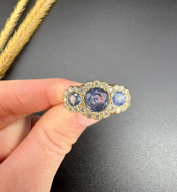 Sapphire and diamond triple daisy ring in gold,