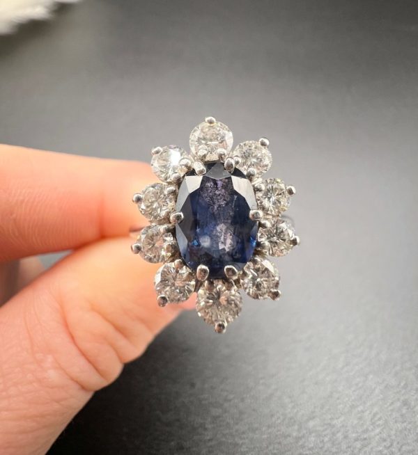Sapphire and diamond cluster ring in white gold.