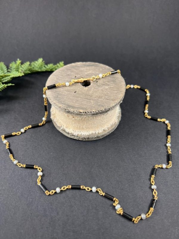 Victorian enamel and pearl long necklace in gold,.