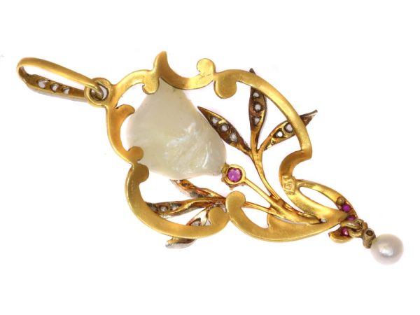 Art Nouveau pearl, diamond and ruby pendant in gold.