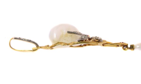 Art Nouveau pearl, diamond and ruby pendant in gold.