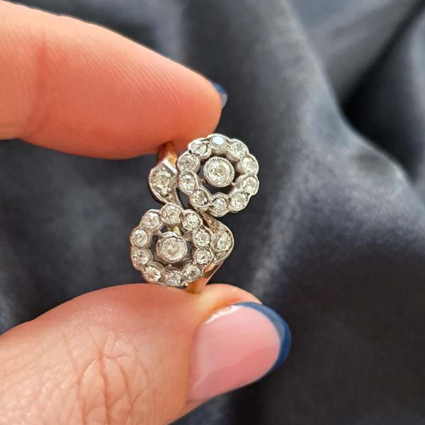 Victorian Antique Diamond Double Floral Cluster Ring, composed of two diamond flower clusters set with sparkling old-cut diamonds in 18ct yellow gold