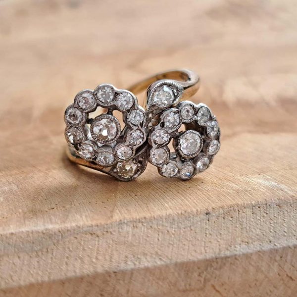 Victorian Antique Diamond Double Floral Cluster Ring, composed of two diamond flower clusters set with sparkling old-cut diamonds in 18ct yellow gold