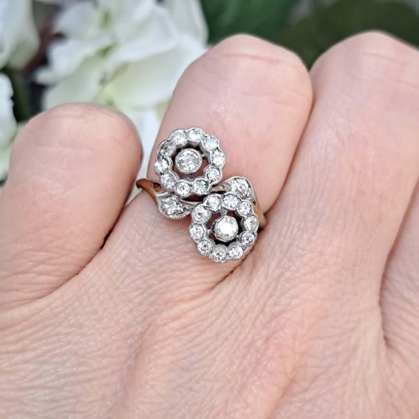 Victorian Antique Diamond Double Floral Cluster Ring, composed of two diamond flower clusters set with sparkling old-cut diamonds in 18ct yellow gold