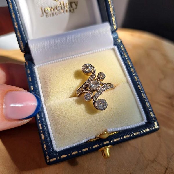 Victorian Antique Old Cut Diamond Ring, central old cut diamond set within curved diamond-set shoulders with larger diamond accents