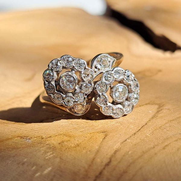 Victorian Antique Diamond Double Floral Cluster Ring, composed of two diamond flower clusters set with sparkling old-cut diamonds in 18ct yellow gold