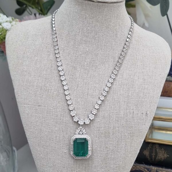 Fine 10ct Emerald and 21.50ct Diamond Cluster Pendant Necklace, emerald-cut emerald in decorative diamond surround suspended from graduated diamond floral cluster necklace