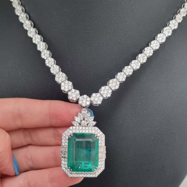 Fine 10ct Emerald and 21.50ct Diamond Cluster Pendant Necklace, emerald-cut emerald in decorative diamond surround suspended from graduated diamond floral cluster necklace