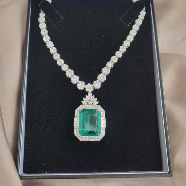 Fine 10ct Emerald and 21.50ct Diamond Cluster Pendant Necklace, emerald-cut emerald in decorative diamond surround suspended from graduated diamond floral flower cluster necklace