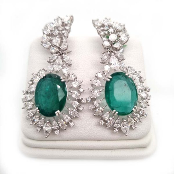 Fine Pair of Emerald and Diamond Cluster Drop Earrings, 10.80ct oval green emeralds in decorative pear and brilliant-cut diamonds surrounds with diamond set spray tops