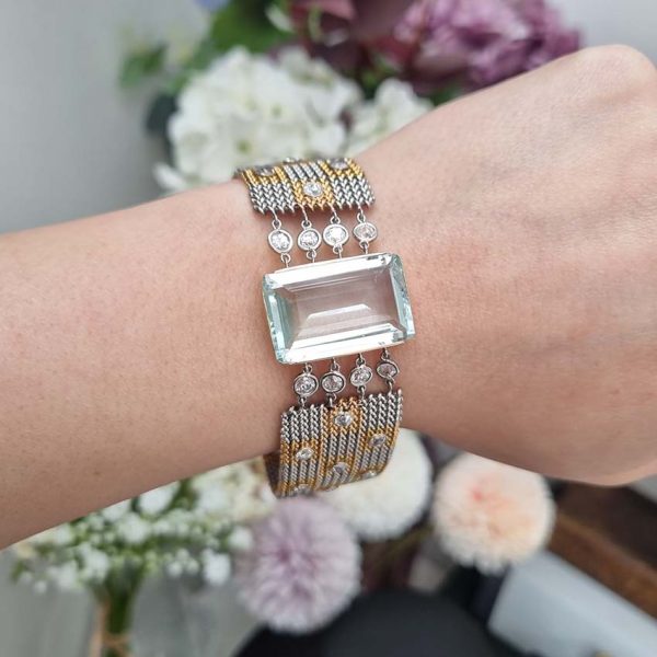 25ct Aquamarine and Diamond Set Bi Colour Gold Mesh Bracelet, square shaped 18ct yellow and white gold woven panels accented with diamonds to large rectangular step-cut aquamarine flanked by diamonds