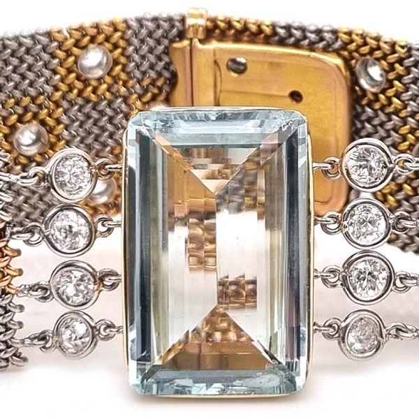 25ct Aquamarine and Diamond Set Bi Colour Gold Mesh Bracelet, square shaped 18ct yellow and white gold woven panels accented with diamonds to large rectangular step-cut aquamarine flanked by diamonds