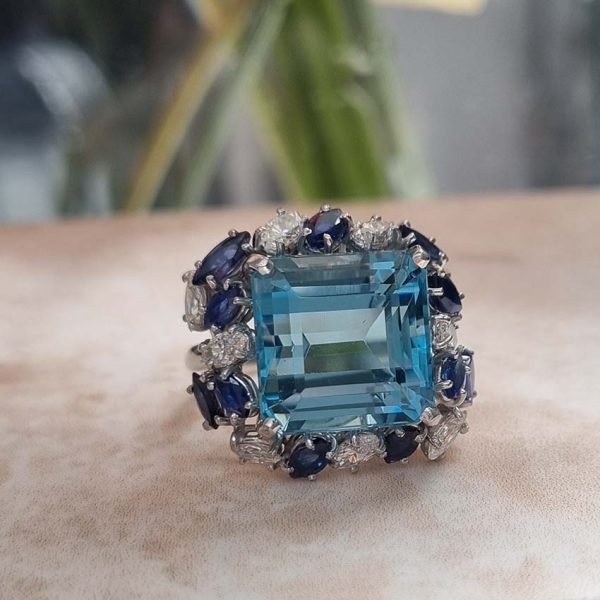 Vintage 12ct Aquamarine with Marquise Diamond and Sapphire Cluster Cocktail Ring in iridium and platinum. Circa 1960s