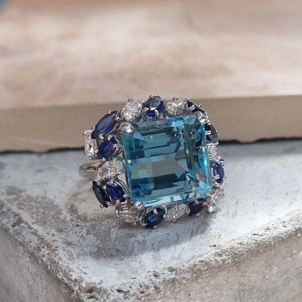 Vintage 12ct Aquamarine with Marquise Diamond and Sapphire Cluster Cocktail Ring in iridium and platinum. Circa 1960s