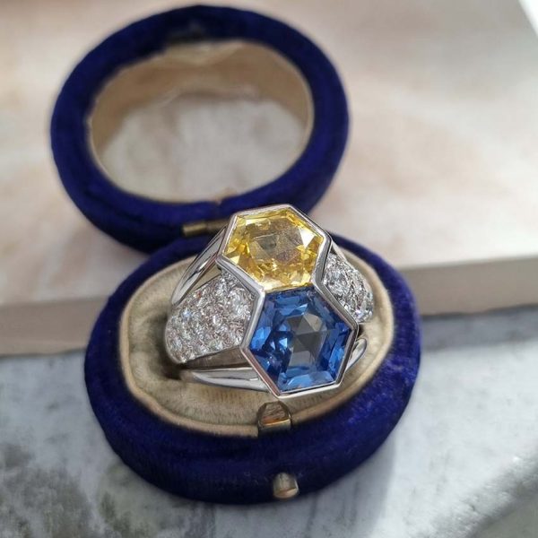 Vintage Hexagonal 8cts Yellow and Blue Sapphire Statement Ring with Diamonds, hexagonal 3.93ct yellow sapphire and 4.24ct blue sapphire set vertically flanked by 1ct pave diamonds in 18ct white gold with ribbed shoulders