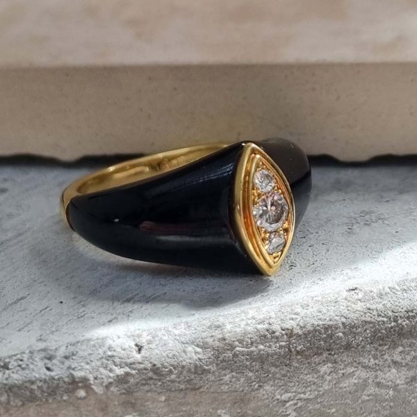 Vintage French Mauboussin Black Enamel and Diamond Ring, Signed and numbered, three sparkling diamonds in a navette/marquise shaped setting atop a domed black enamel mount in 18ct yellow gold