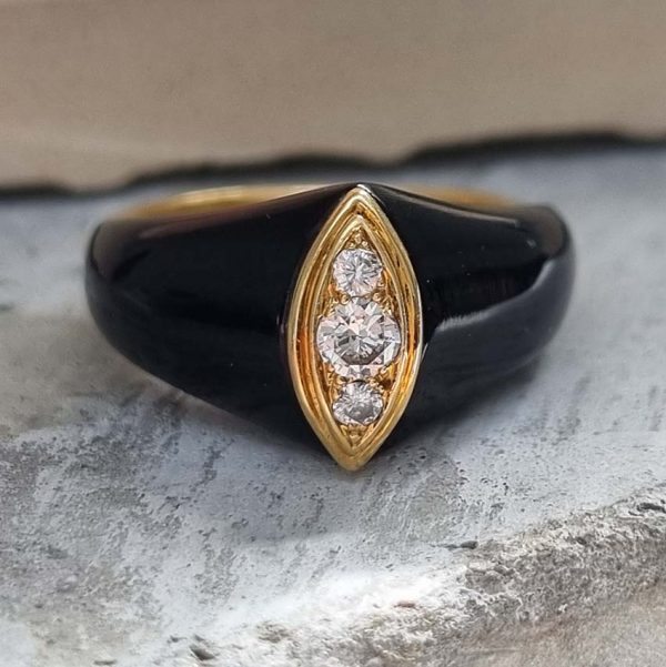 Vintage French Mauboussin Black Enamel and Diamond Ring, Signed and numbered, three sparkling diamonds in a navette/marquise shaped setting atop a domed black enamel mount in 18ct yellow gold