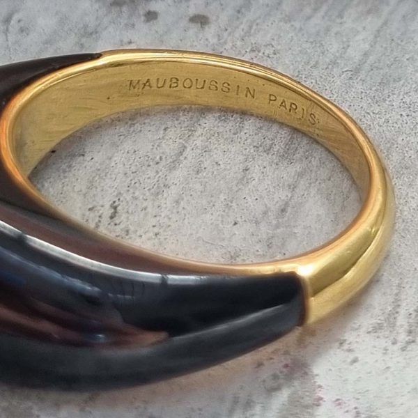 Vintage French Mauboussin Black Enamel and Diamond Ring, Signed and numbered, three sparkling diamonds in a navette/marquise shaped setting atop a domed black enamel mount in 18ct yellow gold