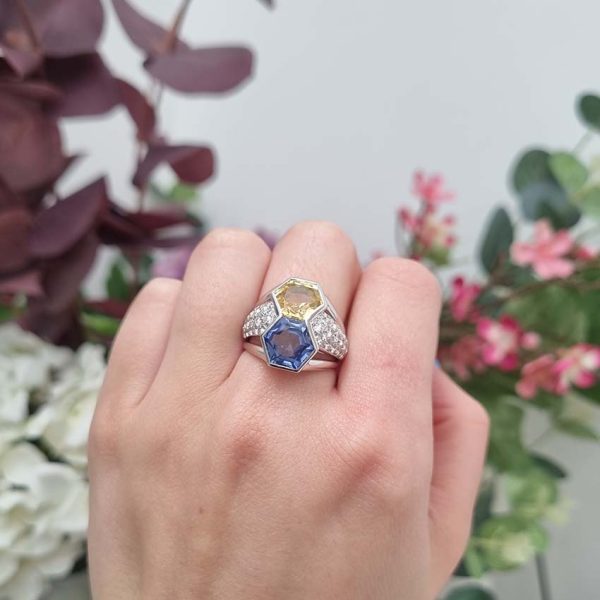 Vintage Hexagonal 8cts Yellow and Blue Sapphire Statement Ring with Diamonds, hexagonal 3.93ct yellow sapphire and 4.24ct blue sapphire set vertically flanked by 1ct pave diamonds in 18ct white gold with ribbed shoulders