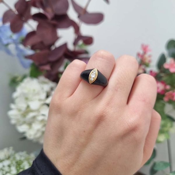Vintage French Mauboussin Black Enamel and Diamond Ring, Signed and numbered, three sparkling diamonds in a navette/marquise shaped setting atop a domed black enamel mount in 18ct yellow gold