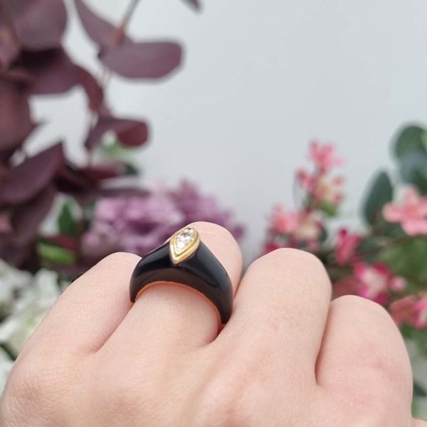 Vintage French Mauboussin Black Enamel and Diamond Ring, Signed and numbered, three sparkling diamonds in a navette/marquise shaped setting atop a domed black enamel mount in 18ct yellow gold