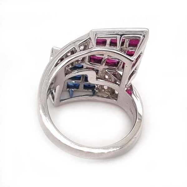 Oscar Heyman Ruby Sapphire Diamond Cocktail Statement Ring, Square cut sapphires and rubies are invisibly set into heads which lead to diamond-set crossover shoulders in 18ct white gold