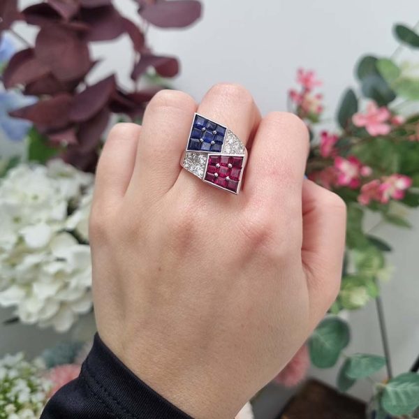 Oscar Heyman Ruby Sapphire Diamond Cocktail Statement Ring, Square cut sapphires and rubies are invisibly set into heads which lead to diamond-set crossover shoulders in 18ct white gold