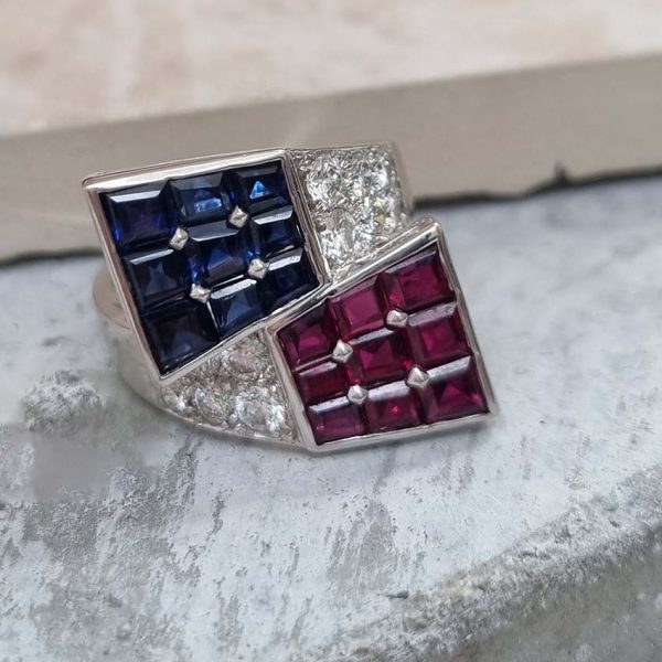 Oscar Heyman Ruby Sapphire Diamond Cocktail Statement Ring, Square cut sapphires and rubies are invisibly set into heads which lead to diamond-set crossover shoulders in 18ct white gold