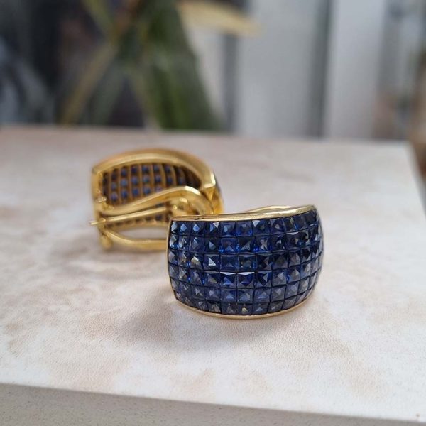 Vintage French Square Cut Sapphire Half Hoop Earrings, 18ct yellow gold half hoop earrings are invisibly set with 156 square French cut sapphires with articulated post and clip fitting. Circa 1980s