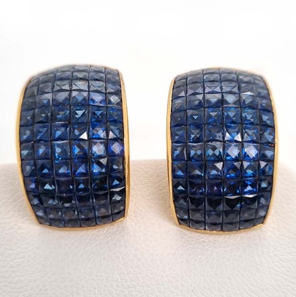 Vintage French Square Cut Sapphire Half Hoop Earrings, 18ct yellow gold half hoop earrings are invisibly set with 156 square French cut sapphires with articulated post and clip fitting. Circa 1980s