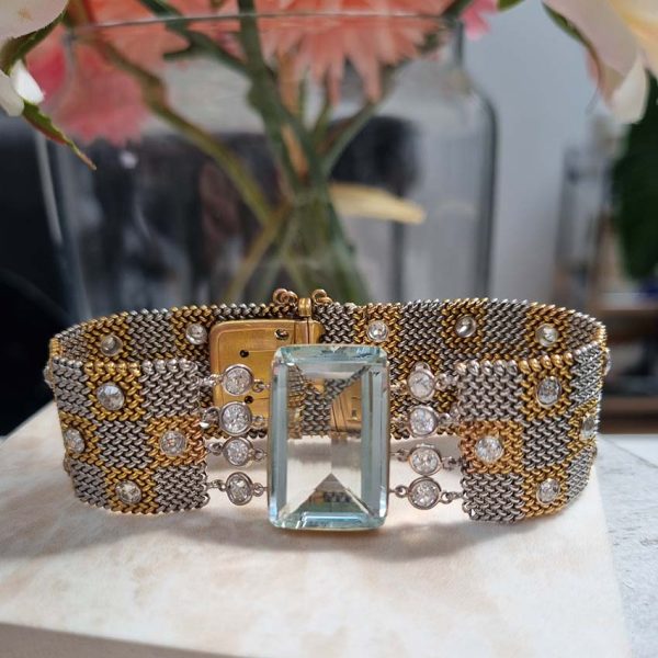 25ct Aquamarine and Diamond Set Bi Colour Gold Mesh Bracelet, square shaped 18ct yellow and white gold woven panels accented with diamonds to large rectangular step-cut aquamarine flanked by diamonds