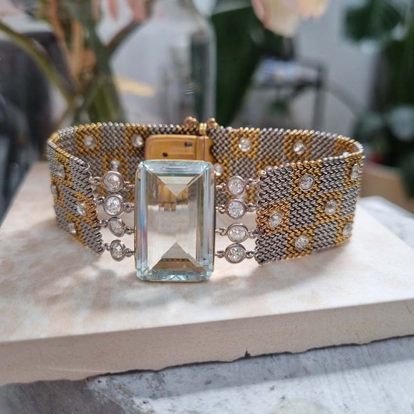 25ct Aquamarine and Diamond Set Bi Colour Gold Mesh Bracelet, square shaped 18ct yellow and white gold woven panels accented with diamonds to large rectangular step-cut aquamarine flanked by diamonds