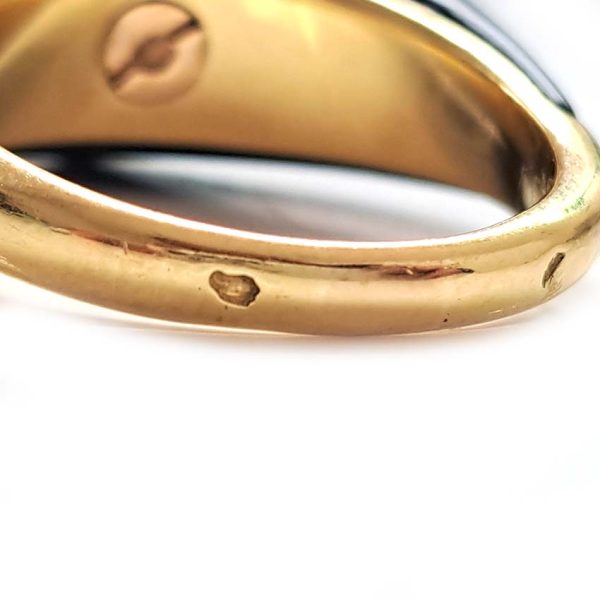 Vintage French Mauboussin Black Enamel and Diamond Ring, Signed and numbered, three sparkling diamonds in a navette/marquise shaped setting atop a domed black enamel mount in 18ct yellow gold