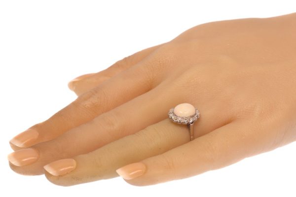 Vintage opal and diamond engagement in platinum.