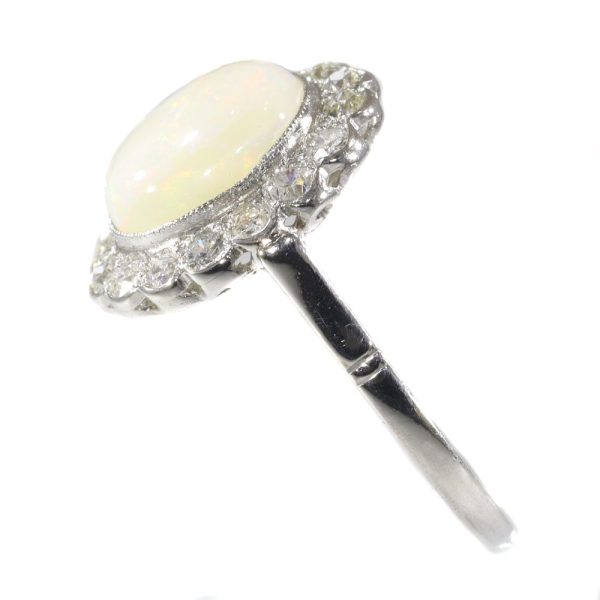 Vintage opal and diamond engagement in platinum.