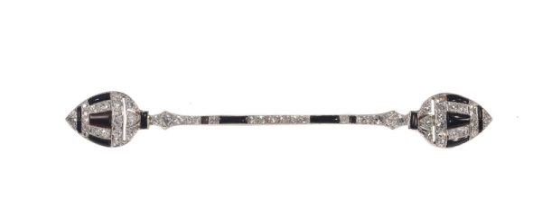 Art Deco diamond and onyx bar brooch in white gold.