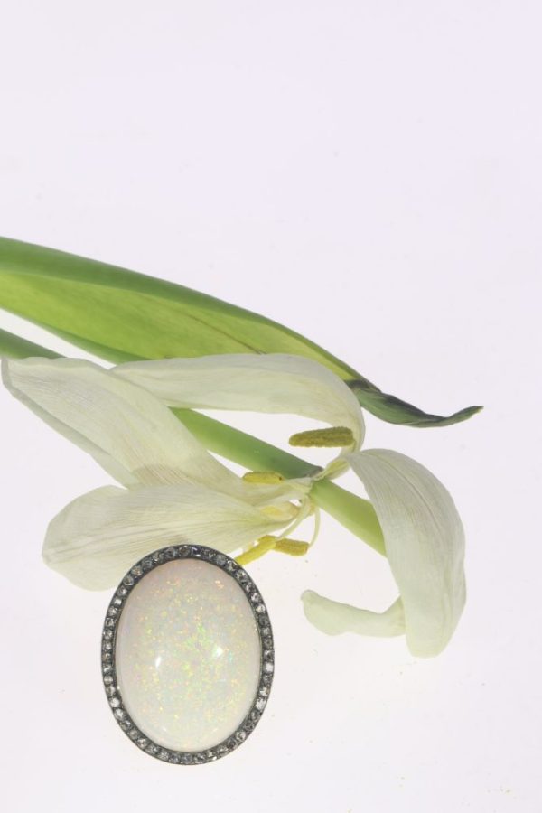 Vintage opal and diamond ring in gold and silver.