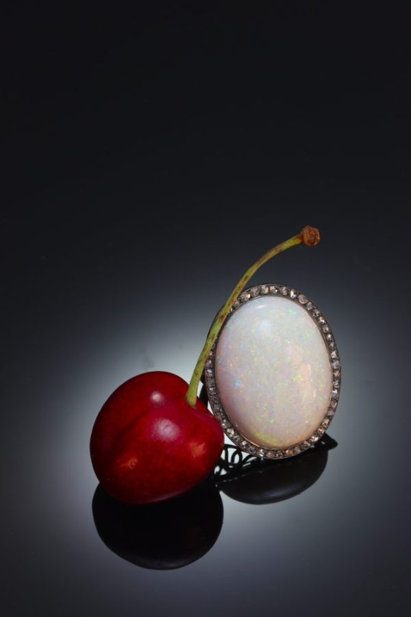 Vintage opal and diamond ring in gold and silver.